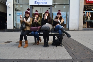 5 artists sit on a bench eating ice-cream in December by Amelia Beavis-Harrison. Image © Polina Panteli